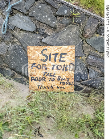 Sign explaining where to find the toilet at Portnoo harbour - County Donegal, Ireland. Sign explaining where to find the toilet at Portnoo harbour - County Donegal, Ireland. 115148969