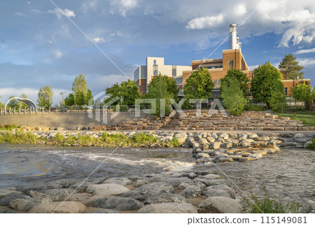 Poudre River at a whitewater park in downtown of Fort Collins Colorado with Powerhouse Energy Campus of Colorado State University in background, spring scenery Poudre River at a whitewater park in downtown of Fort Collins Colorado with Powerhouse Energy Campus of Colorado State University in background, spring scenery 115149081