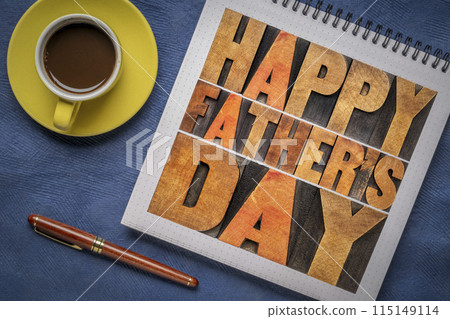 happy father's day - a word abstract in vintage letterpress wood type in a notebook with coffee, greeting card 115149114