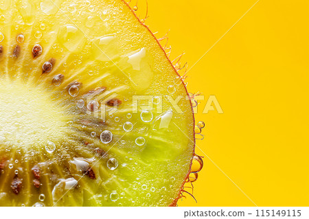 A slice of kiwi fruit with droplets of water on it 115149115