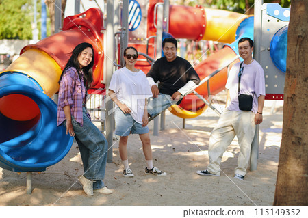 Friends Posing at Colorful Playground 115149352
