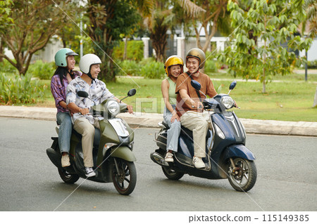 Riding Motorbikes with Friends on a Sunny Day 115149385