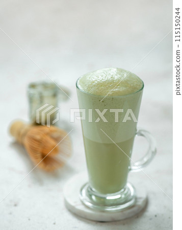Green foam texture of matcha latte, close up Green foam texture of matcha latte, close up 115150244