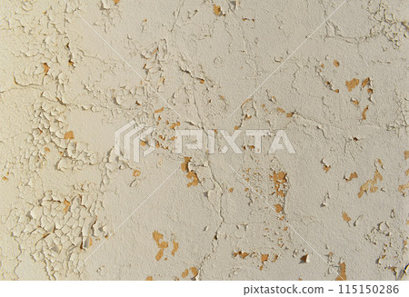 Beige peeling paint wall background, texture of a concrete old wall with stains and cracks Beige peeling paint wall background, texture of a concrete old wall with stains and cracks 115150286