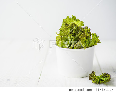 Homemade kale chips ready-to-eat, copy space left 115150297
