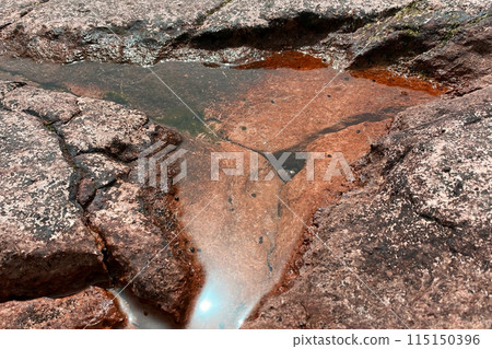 Unusual texture of stone sea shore Unusual texture of stone sea shore 115150396