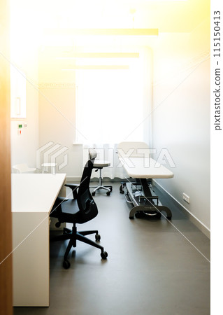 A doctor's office with a couch and a chair to examine a patient's health 115150413
