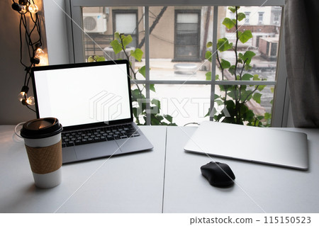 Home office, desktop with laptops and a cup of coffee, freelancer workplace, distant work, work from home 115150523