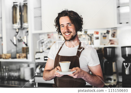 Handsome barista working in coffee shop, preparing coffee. University student working part-time in cafe. 115150693