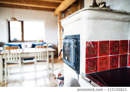 Interior of kitchen in vintage rustic style with wooden furniture in a cottage 115150821