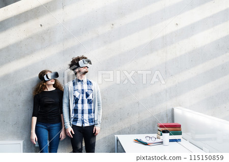 Young university students with VR headset. Virutal reality in academic settings. 115150859