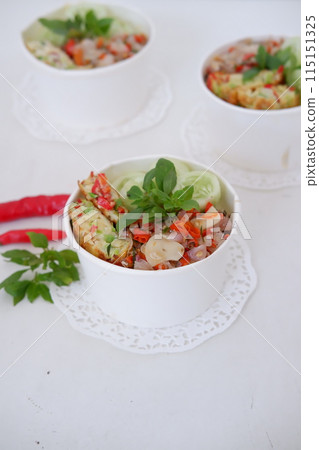rice with scrambled eggs and vegetables in a cup 115151325