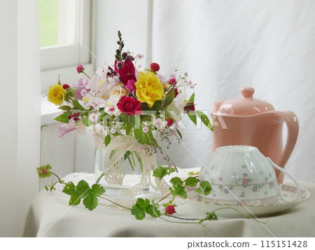Rose arrangement on a windowsill Rose arrangement on a windowsill 115151428