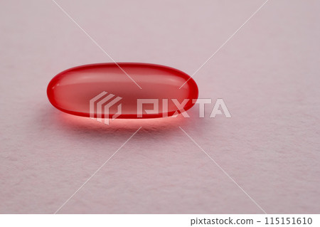 Red pill on white background. Focus on foreground, soft bokeh. colorful tablets, medicines, drugs, health care concept Red pill on white background. Focus on foreground, soft bokeh. colorful tablets, medicines, drugs, health care concept 115151610