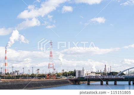 [Kansai Main Line] A local train passing through a factory area 115151805