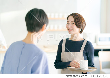 People working in a cafe 115151989