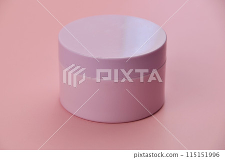 A jar of creamy product set against a soft pink background, creating a delicate and visually pleasing composition. A jar of creamy product set against a soft pink background, creating a delicate and visually pleasing composition. 115151996