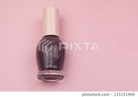 Nail polish small glass bottles on pink background, professional manicure concept Nail polish small glass bottles on pink background, professional manicure concept 115151999