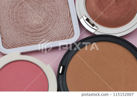 Coral blush, fuchsia eyeshadows and tan face powder on pink background, cosmetics and makeup Coral blush, fuchsia eyeshadows and tan face powder on pink background, cosmetics and makeup 115152007