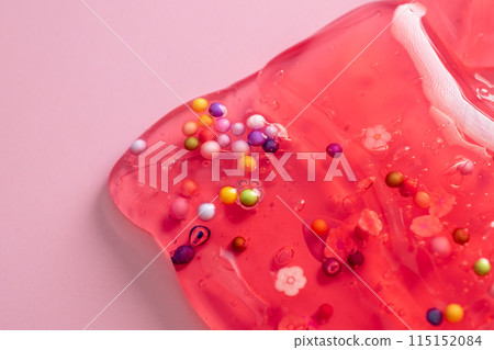 Colorful gel texture, clear skincare cream with bubbles and decorative figurines background, transparent beauty serum, colored cosmetic product close up Colorful gel texture, clear skincare cream with bubbles and decorative figurines background, transparent beauty serum, colored cosmetic product close up 115152084