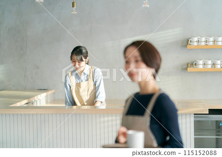 People working in a cafe People working in a cafe 115152088