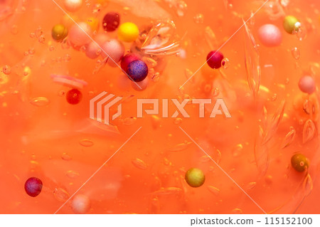 Colorful gel texture, clear skincare cream with bubbles and decorative figurines background, transparent beauty serum, colored cosmetic product close up Colorful gel texture, clear skincare cream with bubbles and decorative figurines background, transparent beauty serum, colored cosmetic product close up 115152100