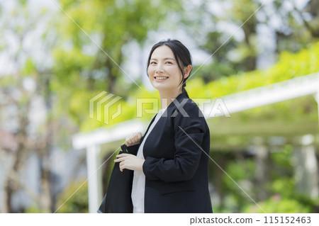 Young woman in a suit Young woman in a suit 115152463