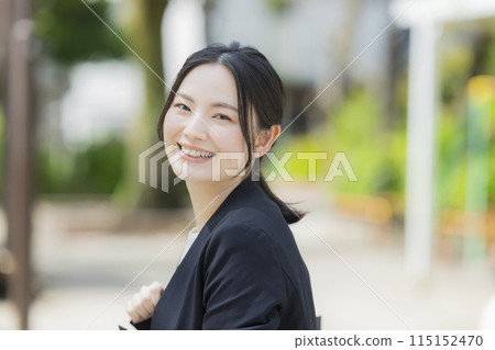 Young woman in a suit 115152470