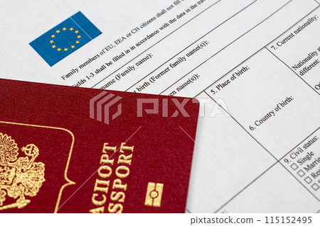 Russian travel passport with Schengen visa application form, sanctions, emigration, immigration, tourism concept Russian travel passport with Schengen visa application form, sanctions, emigration, immigration, tourism concept 115152495