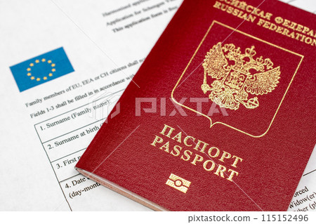 Russian travel passport with Schengen visa application form, sanctions, emigration, immigration, tourism concept 115152496