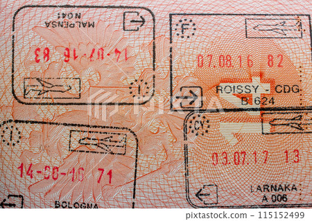 Stamps in a travel passport, entry and exit stamp, emigration, immigration, tourism concept Stamps in a travel passport, entry and exit stamp, emigration, immigration, tourism concept 115152499