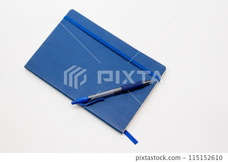 Blue pen and notepad on a white background, notebook with blank sheet 115152610