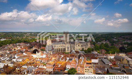 Flight over the city of Canterbury United Kingdom with famous Canterbury Cathedral on a sunny day - 115152946
