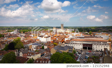 Flight over the city of Canterbury United Kingdom with famous Canterbury Cathedral on a sunny day - 115152948