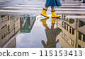 A puddle in an alley after the rain and a child in yellow boots (AI-generated image) 115153413