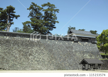 The Taiko Tower and high stone walls seen from the horse pond at Matsue Castle 115153574
