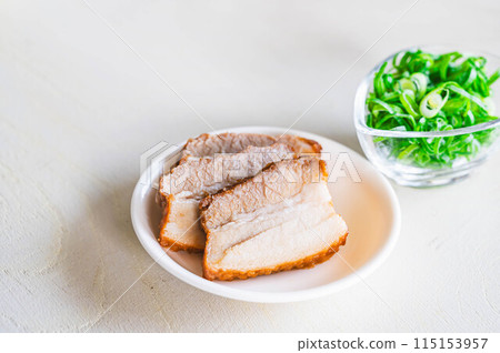 Roast pork and green onions Roast pork and green onions 115153957