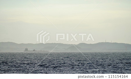 A cargo ship sailing through Tokyo Bay and the Miura Peninsula A cargo ship sailing through Tokyo Bay and the Miura Peninsula 115154164