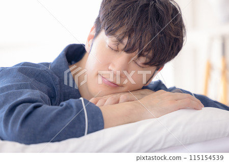 Man sleeping soundly in bed Man sleeping soundly in bed 115154539
