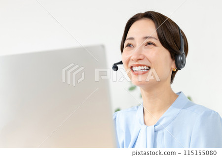 A woman talking with a headset A woman talking with a headset 115155080