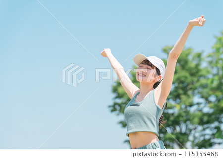 Asian woman taking a deep breath, refreshing, and stretching in the park (exercise, sports, aerobic exercise) Asian woman taking a deep breath, refreshing, and stretching in the park (exercise, sports, aerobic exercise) 115155468