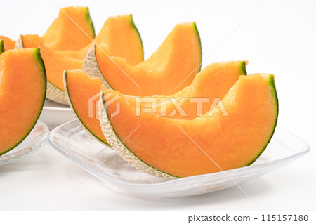 Red flesh cut melon on a plate 115157180