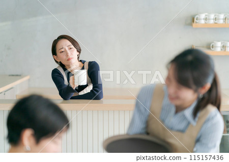 Cafe clerk with a troubled expression Cafe clerk with a troubled expression 115157436