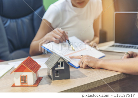 Team diversity women selling house real estate agent at office desk. Women working home insurance mortgage sale apartment realtor dealership. Businesswoman real estate house agent discuss to customer Team diversity women selling house real estate agent at office desk. Women working home insurance mortgage sale apartment realtor dealership. Businesswoman real estate house agent discuss to customer 115157517