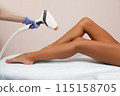 Laser epilation and cosmetology in beauty salon. Hair removal procedure.Beautiful woman getting hair removing on legs 115158705