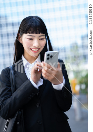 Young business woman with smartphone Young business woman with smartphone 115158910