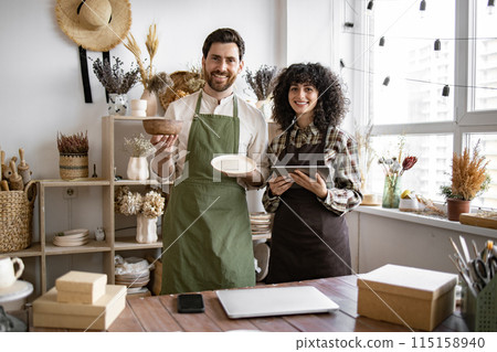 Caucasian people with tablet checking stock goods at shop. Caucasian people with tablet checking stock goods at shop. 115158940