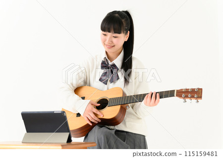 High school girl playing guitar, acoustic guitar High school girl playing guitar, acoustic guitar 115159481