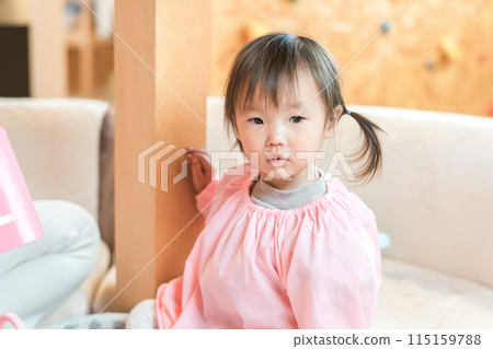 Kindergartener/kindergarten girl at nursery school/kindergarten/daycare center 115159788