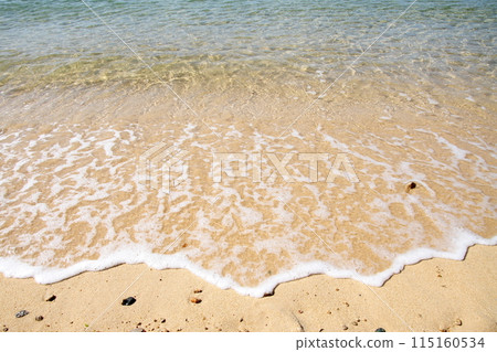 Beautiful sandy beach with waves lapping on the shore of Umashima Island in the Kurushima Strait Beautiful sandy beach with waves lapping on the shore of Umashima Island in the Kurushima Strait 115160534